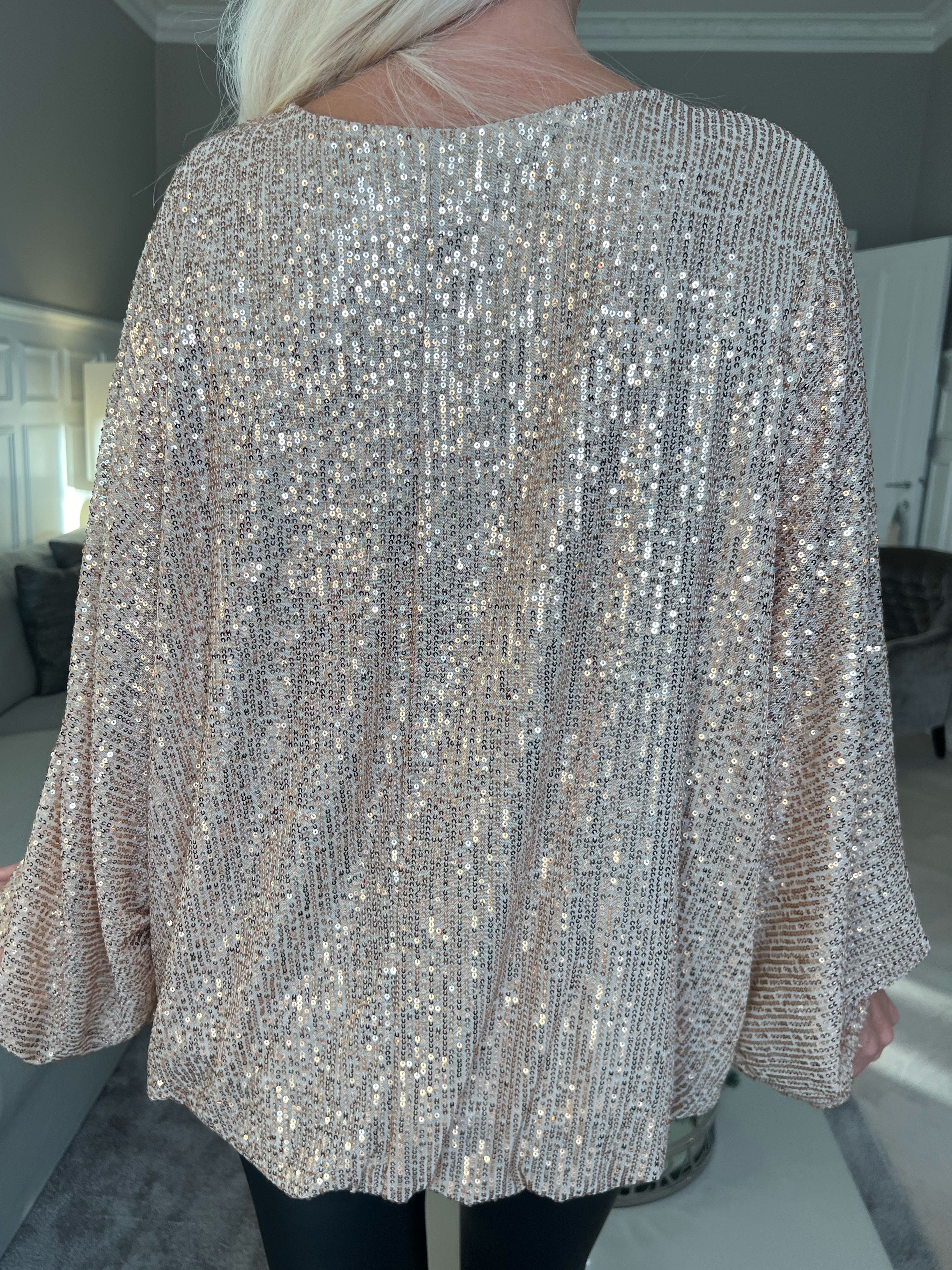 Destiny - Paljettblus med fladdermusärmar